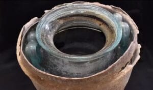 A gold ring was also found in the dark reddish liquid which was filled to the urn's brim (pictured) credit Juan Manuel Roman