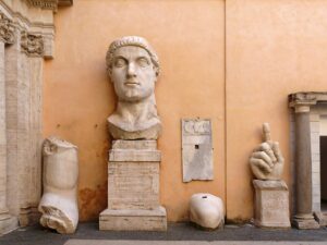 Majestic ancient Roman sculptures displayed in an outdoor museum in Rome, Italy.